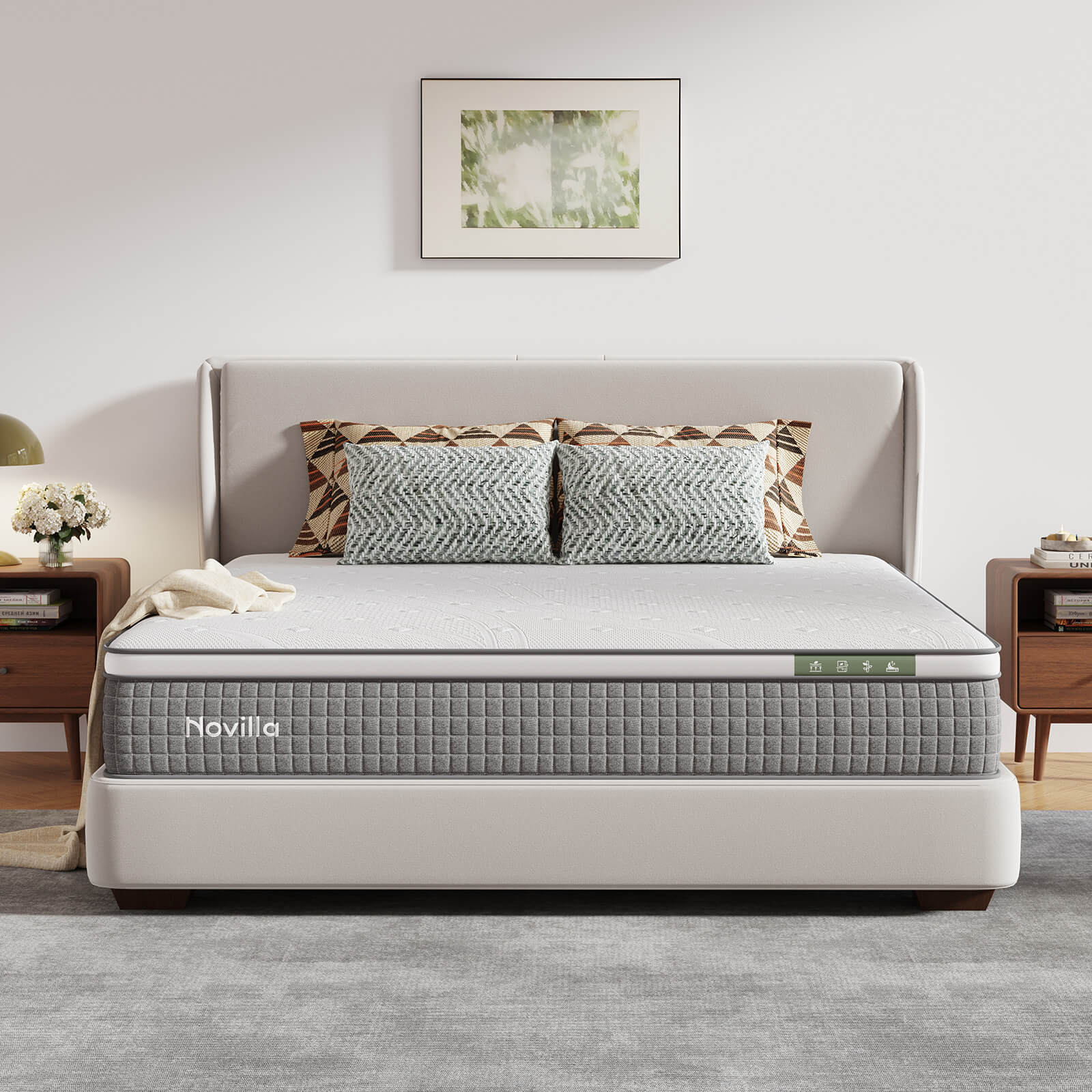 A Novilla hybrid mattress with a white top and grey sides, styled on a bed frame in a modern bedroom