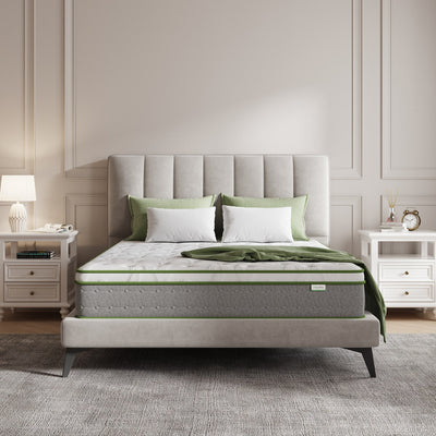 Novilla 10" Serenity Hybrid Mattress on bed with green throw and pillows.