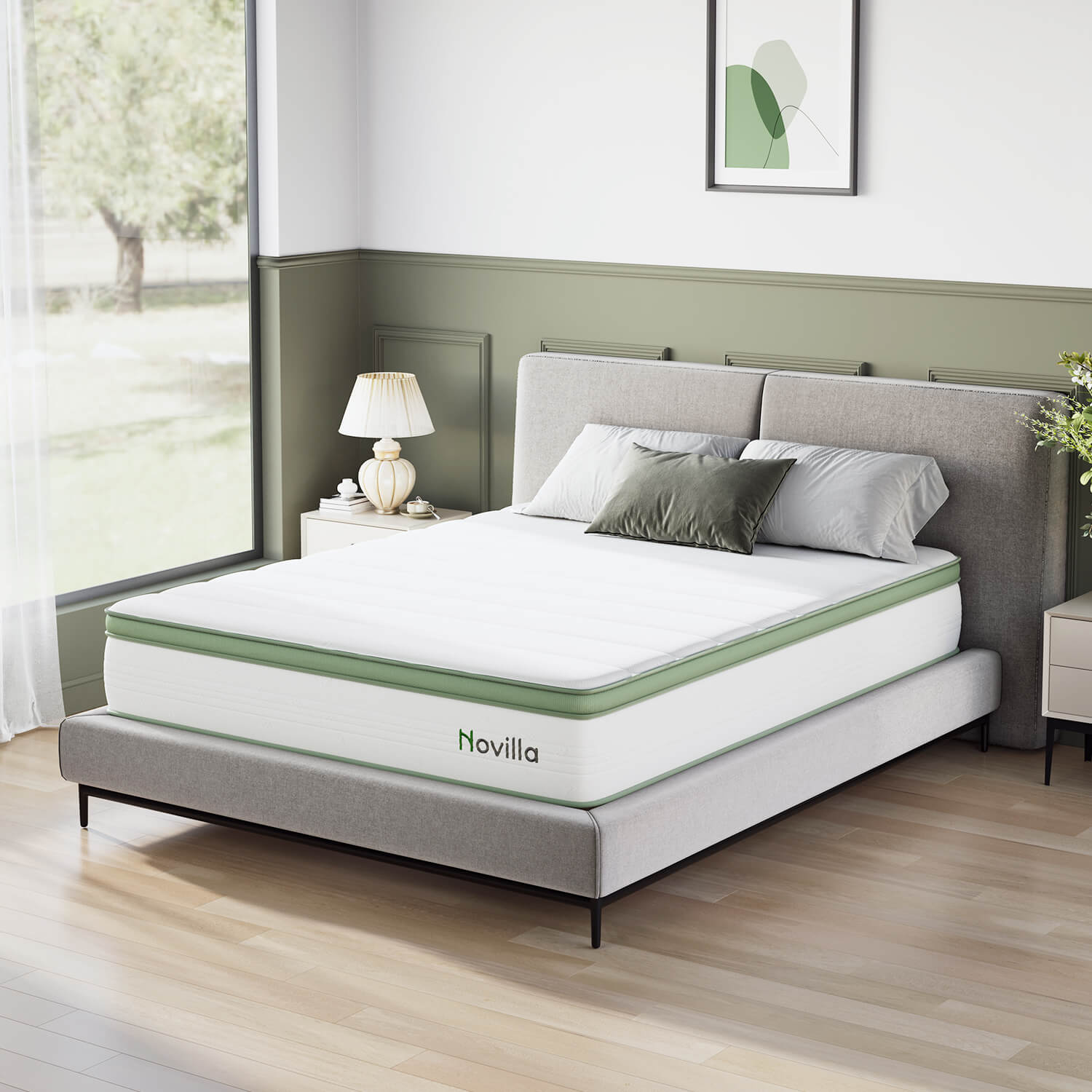 Grove Hybrid Mattress with green border and Novilla logo on a grey bed with pillows and bedside table.