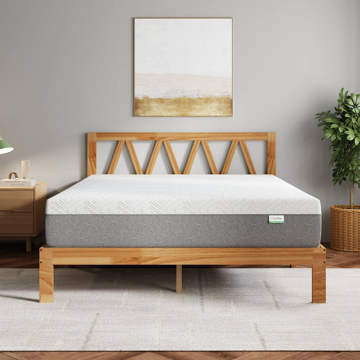 Bliss Platform Bed Bundle: white mattress with grey base on a light wood bed frame in a modern bedroom setting.