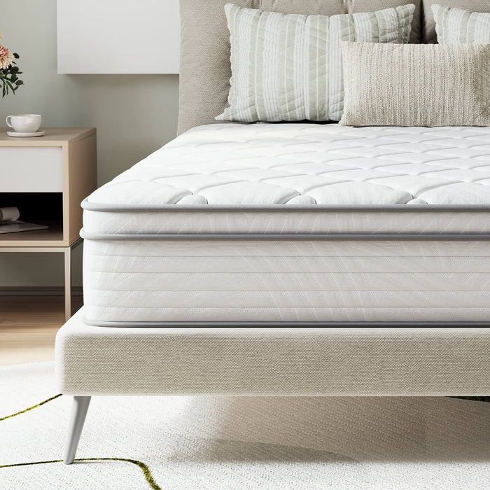 AirBreeze Hybrid Mattress with diamond quilting, grey piping on beige upholstered bed frame with modern legs.