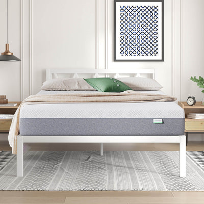 Novilla Bliss Comfort mattress with white quilted top on white bed frame in modern bedroom.